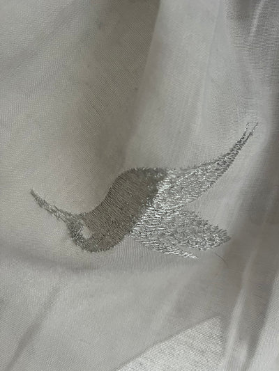 Silver bird on soft grey scarf
